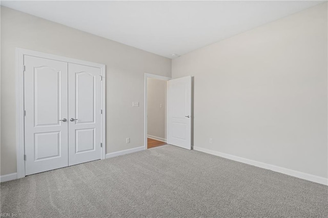 151 Highland Pony Dr, Hertford, NC 27944 - unfurnished bedroom with carpet flooring, baseboards, and a closet
