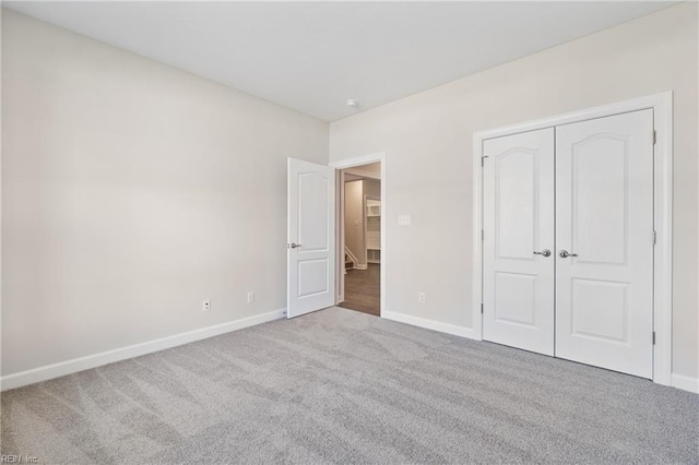151 Highland Pony Dr, Hertford, NC 27944 - unfurnished bedroom featuring carpet flooring, baseboards, and a closet