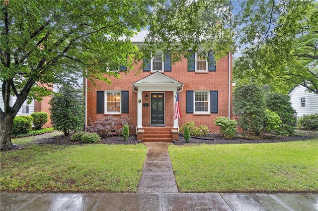 3 Acorn St, Hampton, VA 23669 - view of front facade with a front yard and brick siding