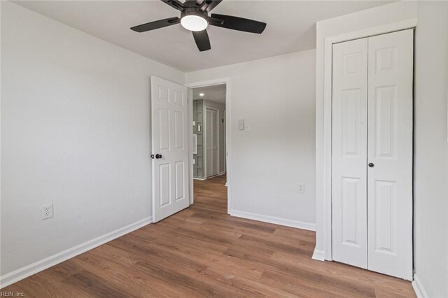 10 Hopkins St, Hampton, VA 23663 - unfurnished bedroom featuring wood finished floors, baseboards, a closet, and ceiling fan