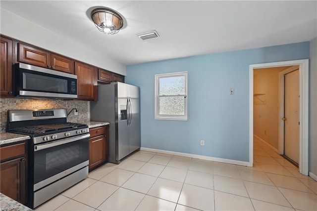 1405 Collingswood Trl, Virginia Beach, VA 23464 - kitchen with stainless steel appliances, tasteful backsplash, baseboards, and light tile patterned floors