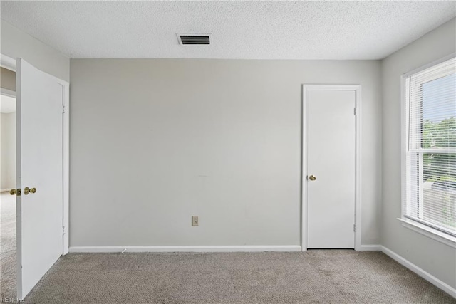1405 Collingswood Trl, Virginia Beach, VA 23464 - unfurnished bedroom featuring carpet floors, a textured ceiling, and baseboards