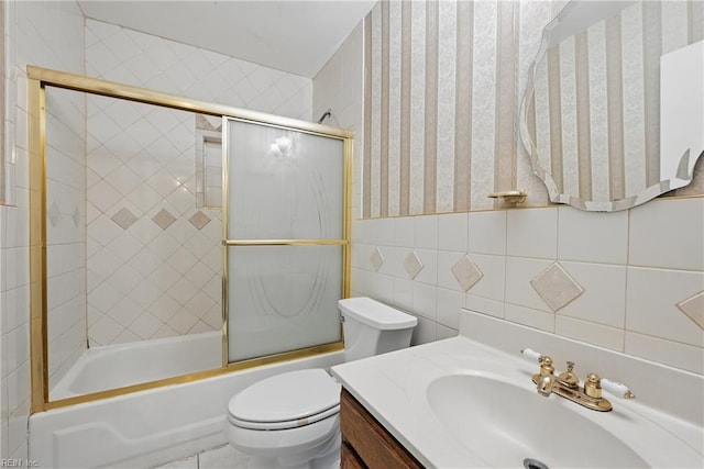 1405 Collingswood Trl, Virginia Beach, VA 23464 - bathroom with wallpapered walls, vanity, toilet, shower / bath combination with glass door, and tile walls