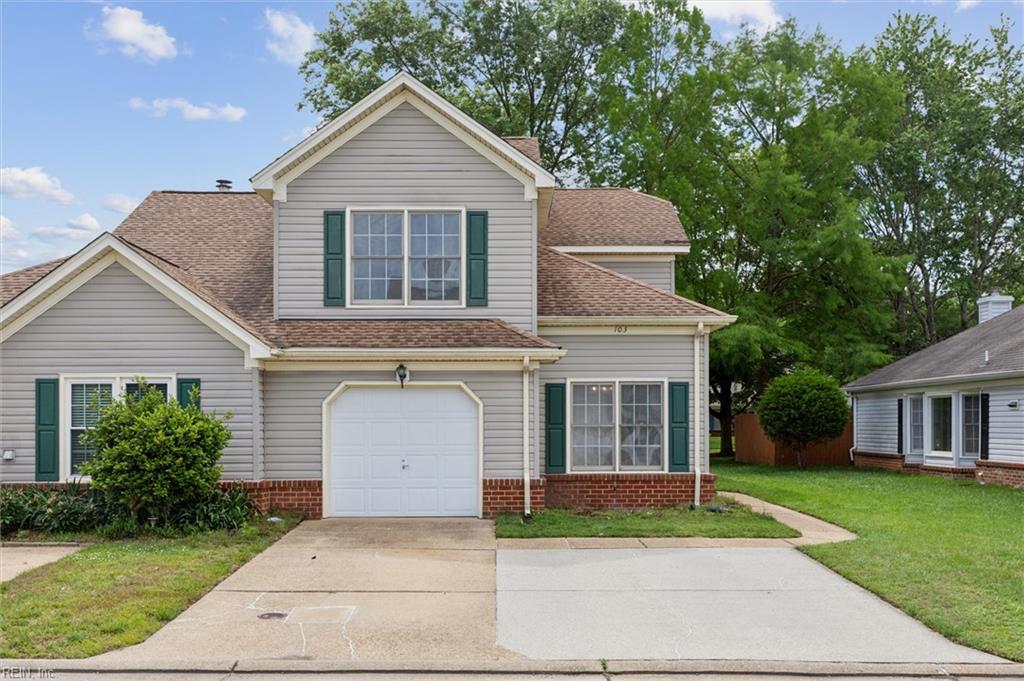 103 Penny Ln, Yorktown, VA 23692 - traditional-style home featuring a front lawn, concrete driveway, roof with shingles, and a garage