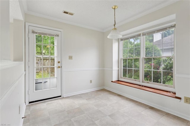 103 Penny Ln, Yorktown, VA 23692 - unfurnished dining area featuring crown molding and a textured ceiling