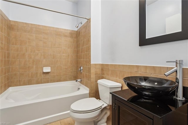415 Saint Pauls Blvd Unit 609, Norfolk, VA 23510 - full bath with tile walls, toilet, washtub / shower combination, vanity, and a wainscoted wall