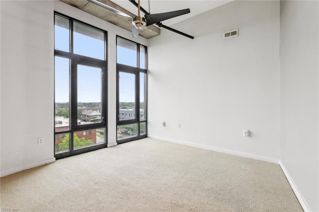 415 Saint Pauls Blvd Unit 609, Norfolk, VA 23510 - unfurnished room with carpet flooring, healthy amount of natural light, ceiling fan, and a high ceiling