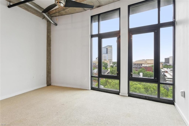 415 Saint Pauls Blvd Unit 609, Norfolk, VA 23510 - carpeted spare room featuring a ceiling fan, healthy amount of natural light, a high ceiling, and a city view