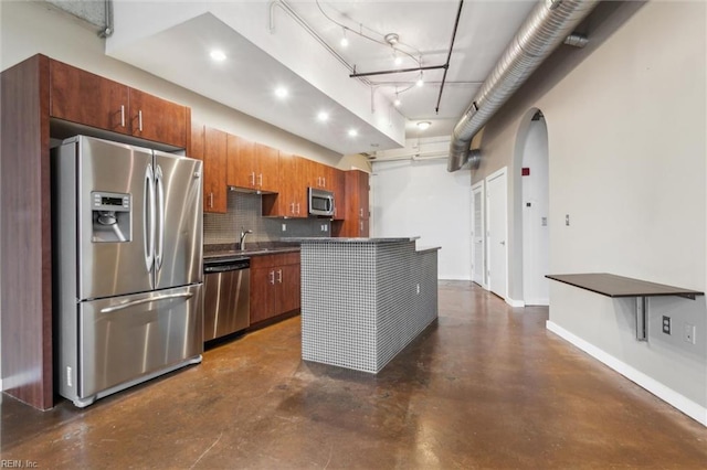 415 Saint Pauls Blvd Unit 609, Norfolk, VA 23510 - kitchen featuring stainless steel appliances, finished concrete floors, arched walkways, decorative backsplash, and a sink
