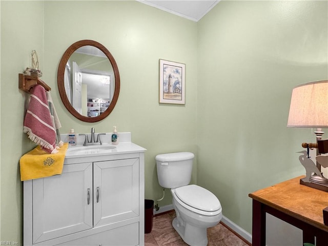 585 Morse Point Rd, Port Haywood, VA 23138 - bathroom featuring vanity, toilet, baseboards, ornamental molding, and tile patterned flooring