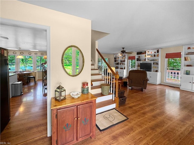 585 Morse Point Rd, Port Haywood, VA 23138 - living area with ceiling fan, wood finished floors, and healthy amount of natural light