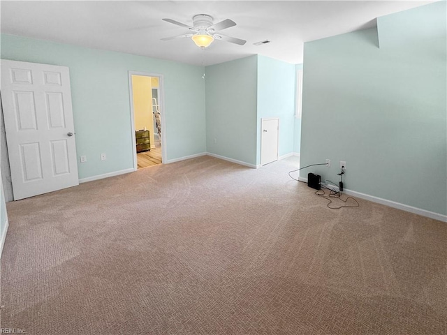585 Morse Point Rd, Port Haywood, VA 23138 - empty room featuring light colored carpet, ceiling fan, and baseboards