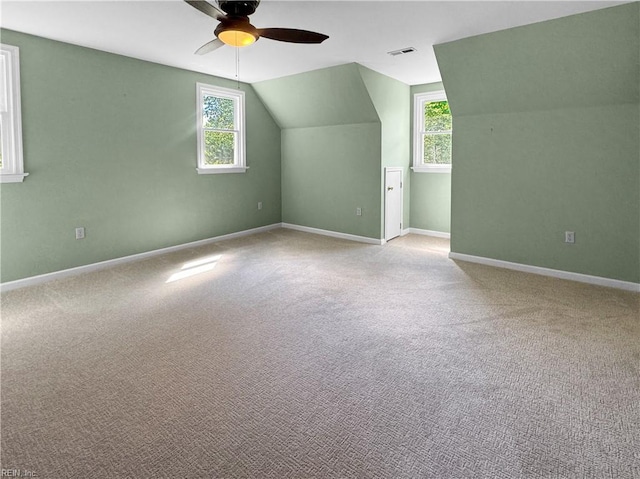 585 Morse Point Rd, Port Haywood, VA 23138 - bonus room with a ceiling fan, plenty of natural light, lofted ceiling, and light colored carpet