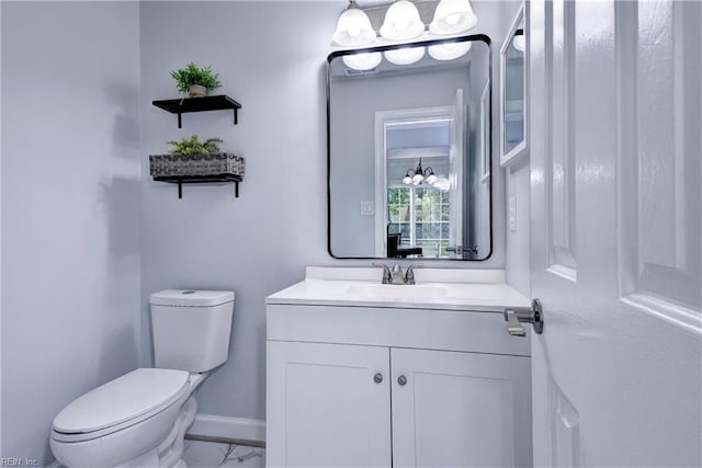 39 Morrison Ave, Newport News, VA 23601 - bathroom with toilet, marble look tile flooring, vanity, and baseboards