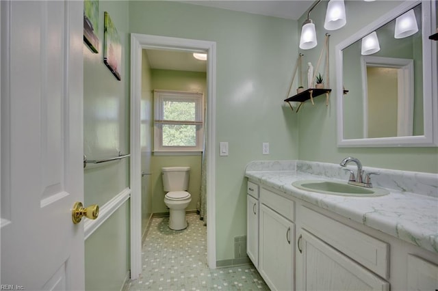 4217 Meadowgate Ct, Chesapeake, VA 23321 - bathroom with vanity, toilet, and baseboards
