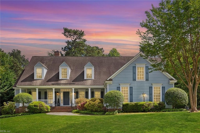 133 Sugar Bush, Williamsburg, VA 23188 - view of front of house with a lawn, a porch, a chimney, and roof with shingles
