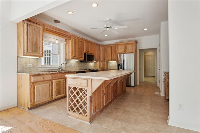 133 Sugar Bush, Williamsburg, VA 23188 - kitchen with stainless steel appliances, light countertops, a sink, a ceiling fan, and recessed lighting