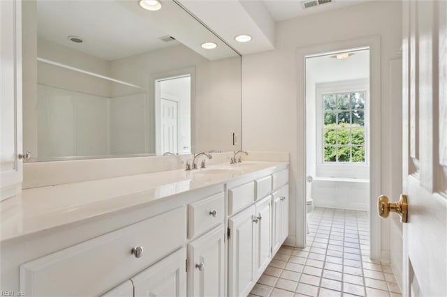 133 Sugar Bush, Williamsburg, VA 23188 - full bathroom featuring toilet, double vanity, tile patterned floors, recessed lighting, and a shower