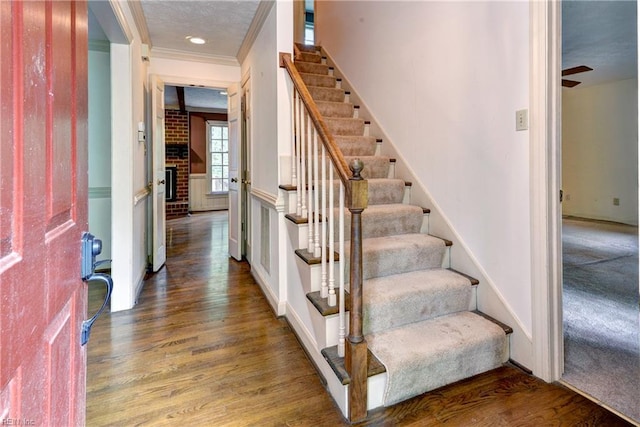 104 James Longstreet, Williamsburg, VA 23185 - entrance foyer with stairway, wood finished floors, and crown molding