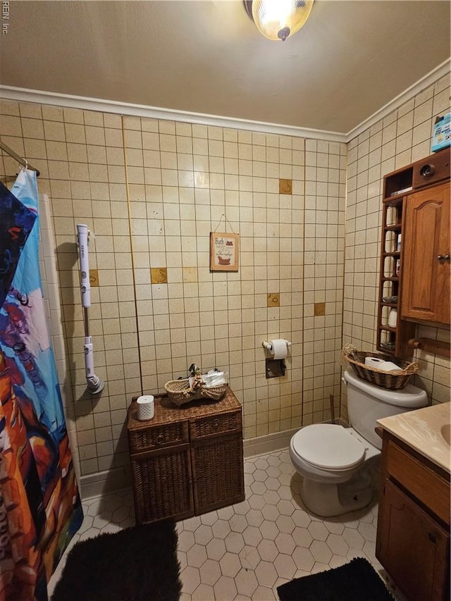 1428 24th St, Newport News, VA 23607 - full bath featuring tile walls, vanity, crown molding, toilet, and tile patterned floors
