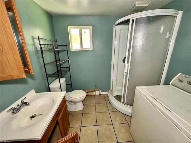3860 Nansemond Cir, Norfolk, VA 23513 - full bath with washer / clothes dryer, toilet, a shower stall, vanity, and tile patterned floors