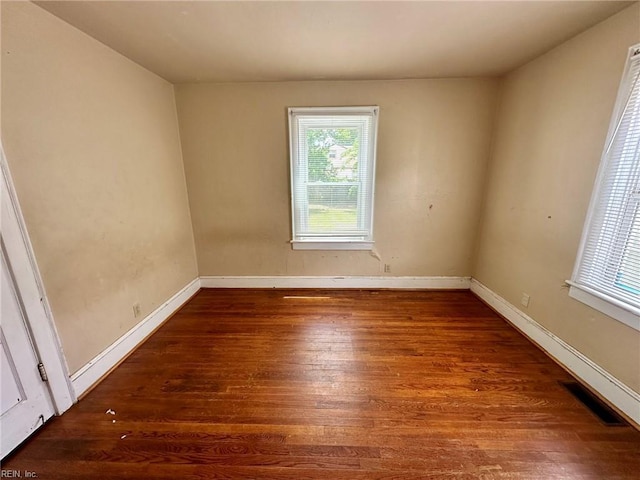 3860 Nansemond Cir, Norfolk, VA 23513 - spare room featuring plenty of natural light, wood-type flooring, and baseboards