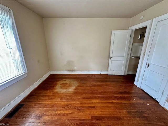 3860 Nansemond Cir, Norfolk, VA 23513 - unfurnished bedroom with wood finished floors and baseboards