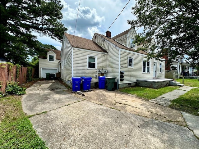 3860 Nansemond Cir, Norfolk, VA 23513 - rear view of house featuring concrete driveway, a chimney, roof with shingles, and a garage