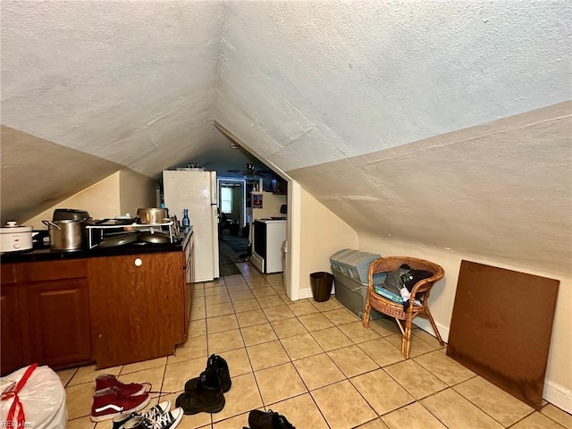 3860 Nansemond Cir, Norfolk, VA 23513 - bonus room with a textured ceiling, light tile patterned flooring, vaulted ceiling, and baseboards