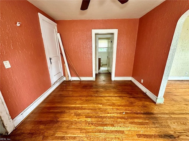 3860 Nansemond Cir, Norfolk, VA 23513 - unfurnished bedroom with a textured wall, wood finished floors, baseboards, and a ceiling fan