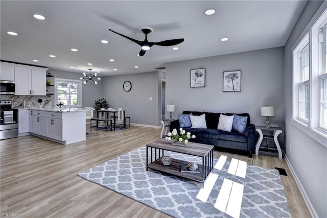 717 S Fallon Ct, Hampton, VA 23661 - living room featuring light wood-style flooring, ceiling fan, recessed lighting, a chandelier, and baseboards