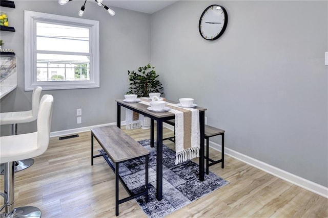 717 S Fallon Ct, Hampton, VA 23661 - home office featuring light wood-type flooring, baseboards, and a chandelier