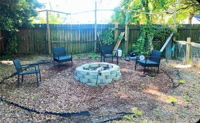 11 Greenwood Rd, Newport News, VA 23601 - fenced backyard with an outdoor fire pit