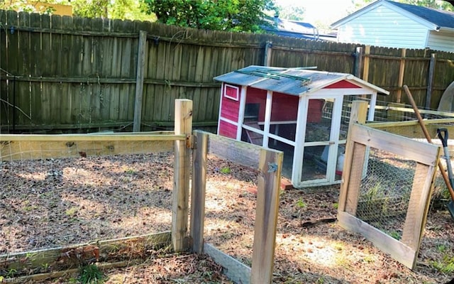 11 Greenwood Rd, Newport News, VA 23601 - fenced backyard featuring exterior structure and an outdoor structure