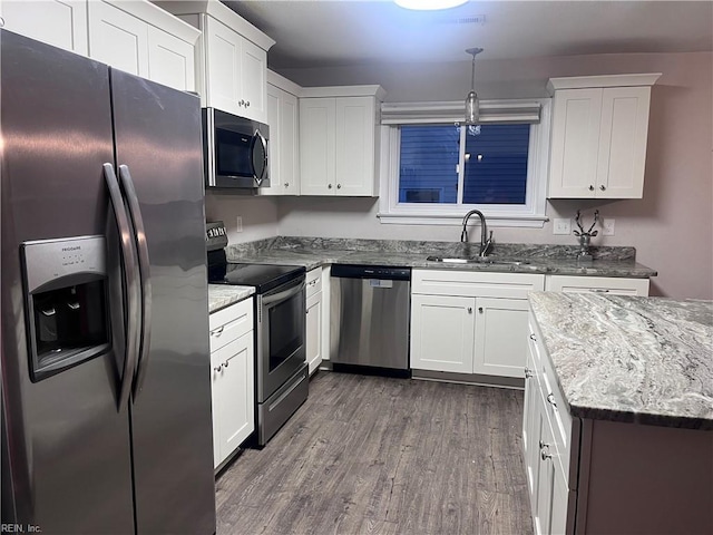 11 Greenwood Rd, Newport News, VA 23601 - kitchen with stainless steel appliances, a sink, dark wood finished floors, and white cabinets