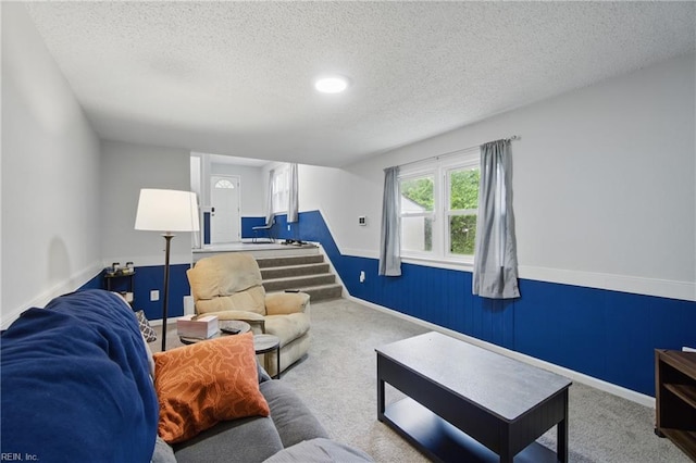 6628 Glenoak Dr, Norfolk, VA 23513 - living area featuring carpet flooring, a textured ceiling, and stairway