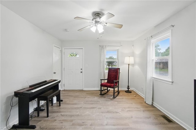 6628 Glenoak Dr, Norfolk, VA 23513 - sitting room featuring healthy amount of natural light, ceiling fan, light wood-style floors, and baseboards