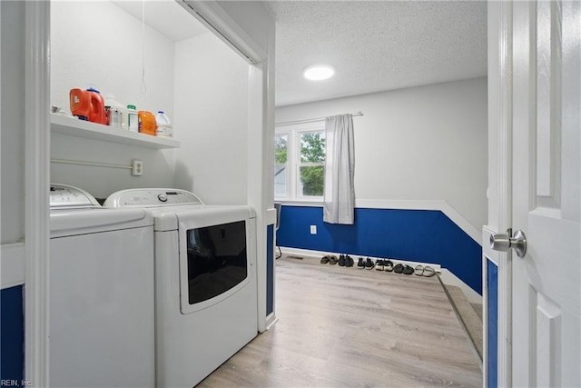 6628 Glenoak Dr, Norfolk, VA 23513 - washroom featuring wood finished floors, washing machine and dryer, a textured ceiling, and baseboards