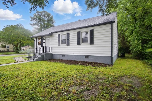 6628 Glenoak Dr, Norfolk, VA 23513 - view of front facade with crawl space, a front yard, and roof with shingles