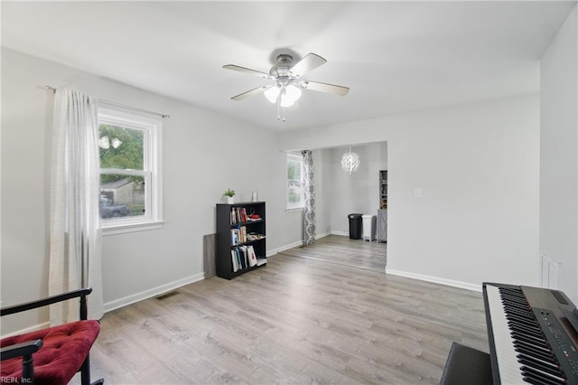 6628 Glenoak Dr, Norfolk, VA 23513 - living area with ceiling fan, light wood-style flooring, and baseboards