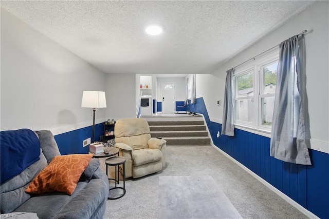 6628 Glenoak Dr, Norfolk, VA 23513 - living area featuring a textured ceiling, carpet, and a wainscoted wall