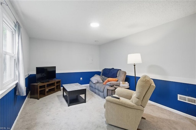 6628 Glenoak Dr, Norfolk, VA 23513 - carpeted living room with baseboards and a textured ceiling