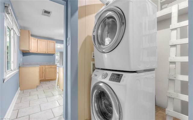 4704 Lonewillow Ln, Virginia Beach, VA 23455 - laundry room with stacked washing machine and dryer, baseboards, and light tile patterned floors