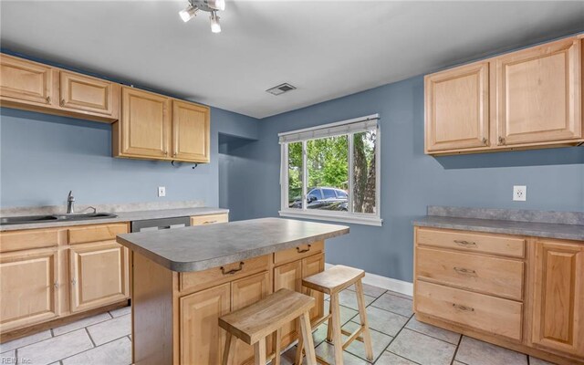 4704 Lonewillow Ln, Virginia Beach, VA 23455 - kitchen featuring light brown cabinets, a sink, light tile patterned floors, and a kitchen breakfast bar