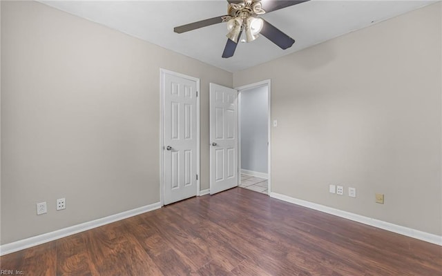 4704 Lonewillow Ln, Virginia Beach, VA 23455 - unfurnished bedroom featuring baseboards, wood finished floors, and a ceiling fan