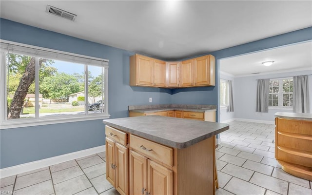 4704 Lonewillow Ln, Virginia Beach, VA 23455 - kitchen featuring light tile patterned floors, a kitchen island, baseboards, light brown cabinets, and dark countertops