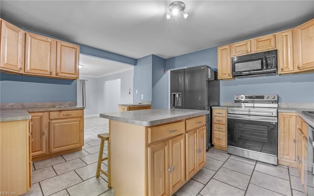 4704 Lonewillow Ln, Virginia Beach, VA 23455 - kitchen with black appliances, light brown cabinets, light tile patterned floors, a center island, and a kitchen breakfast bar