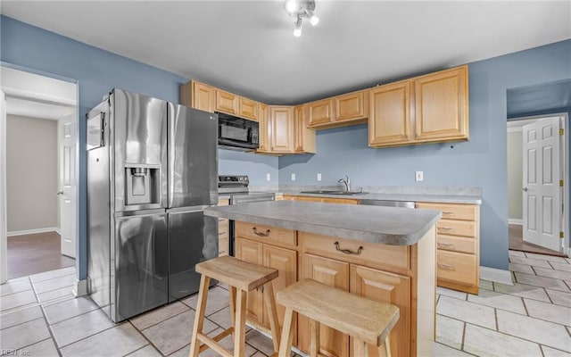 4704 Lonewillow Ln, Virginia Beach, VA 23455 - kitchen with stainless steel appliances, light brown cabinetry, a sink, and light tile patterned floors