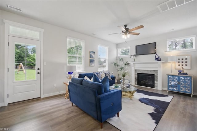 653 Waters Rd, Chesapeake, VA 23322 - living room with wood finished floors, a glass covered fireplace, a ceiling fan, and baseboards