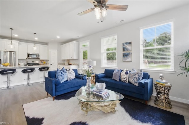 653 Waters Rd, Chesapeake, VA 23322 - living area with wood finished floors, ceiling fan, recessed lighting, and baseboards